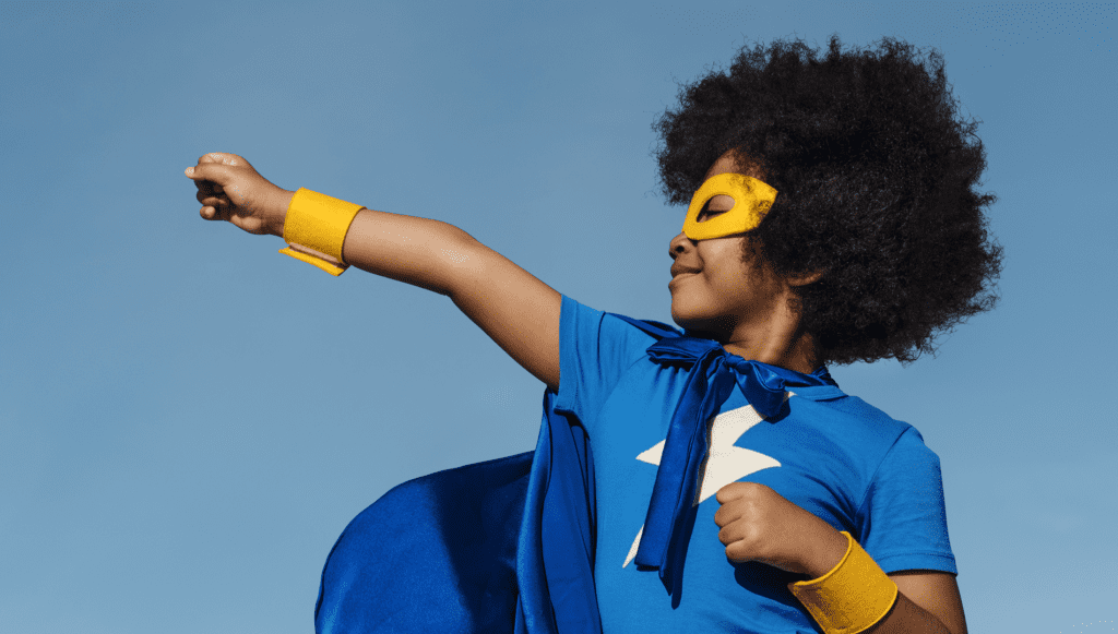 Young child role model of a superhero stance