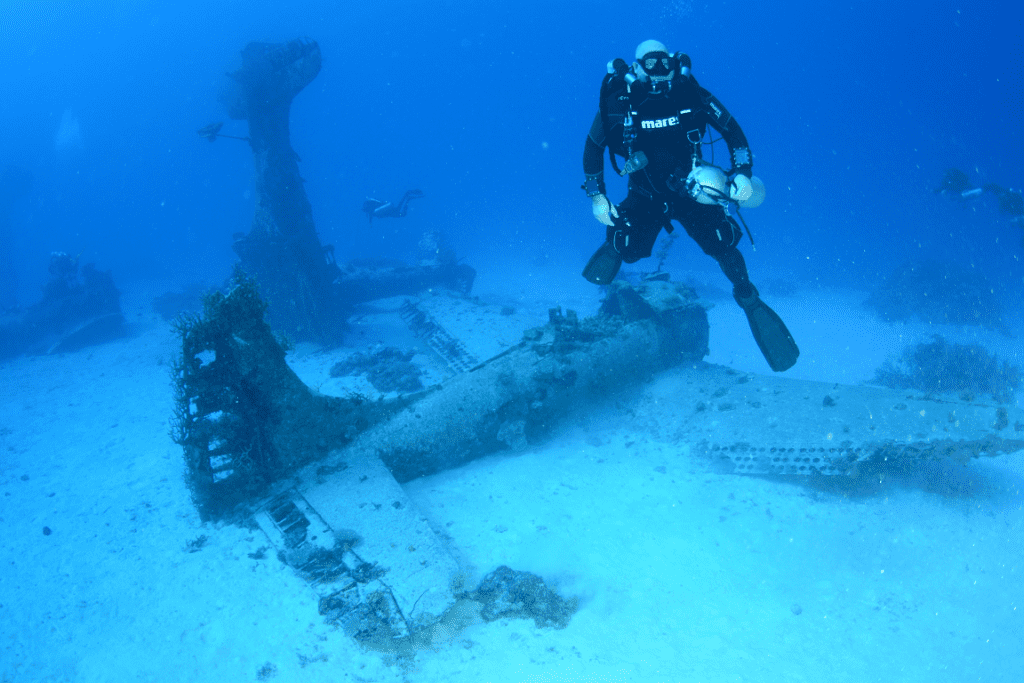 Wreck diving in Micronesia, underwater with a WWII airplane