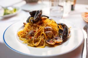 Italian pasta with seafood and herbs on the restaurant table...and then a nap