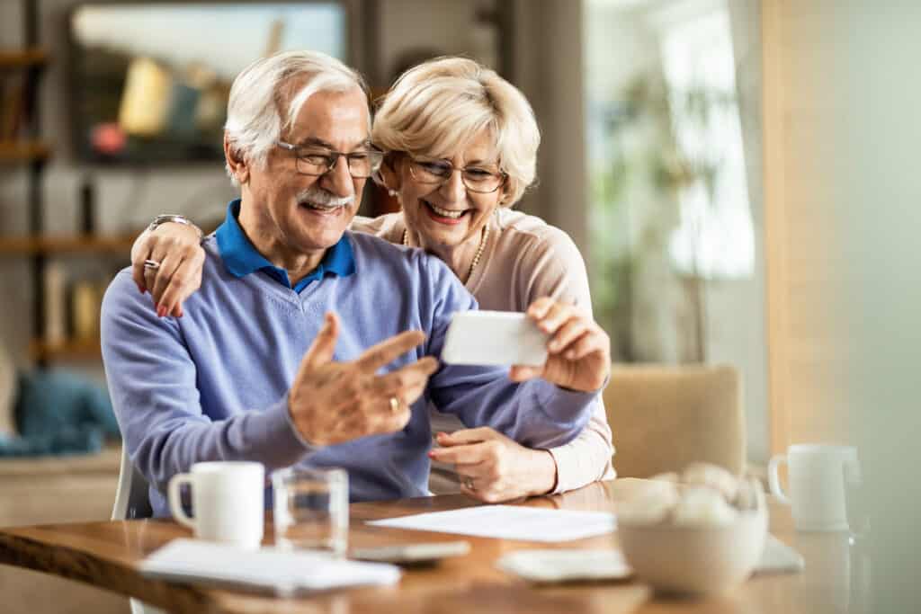 Retired couple using social media 