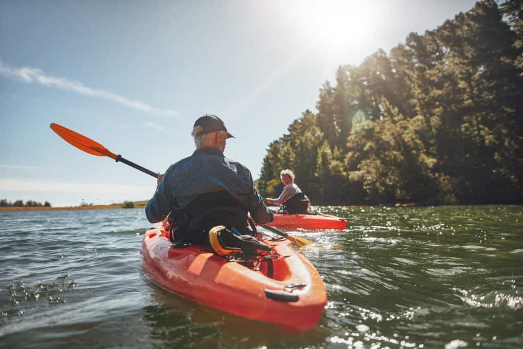 active retired couple kayaking