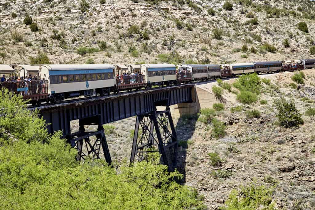 Clarkdale, Arizona, USA - May 4, 2019: Verde Canyon Railroad train driving on scenic route over a bridge