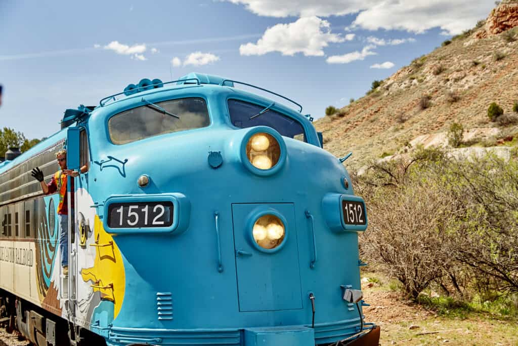 Clarkdale, Arizona, USA - May 4, 2019: Verde Canyon Railroad train engine and engineer driving on scenic route