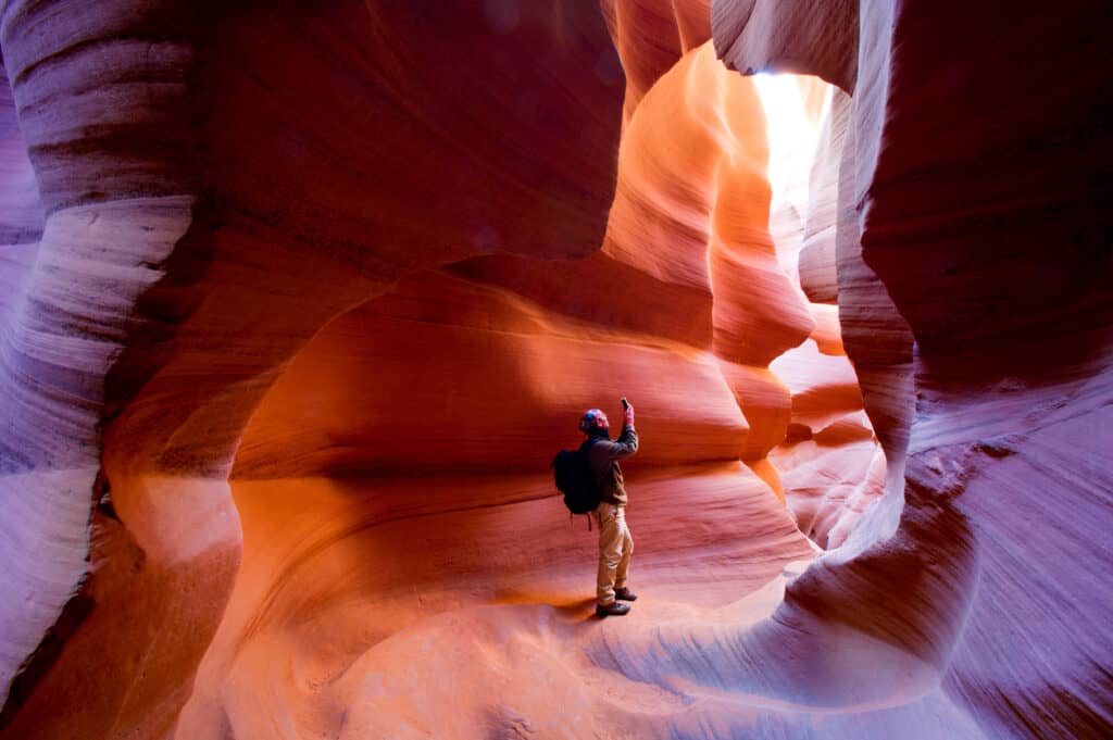 sedona tours for seniors as this man walks thru Antelope Canyon in Arizona