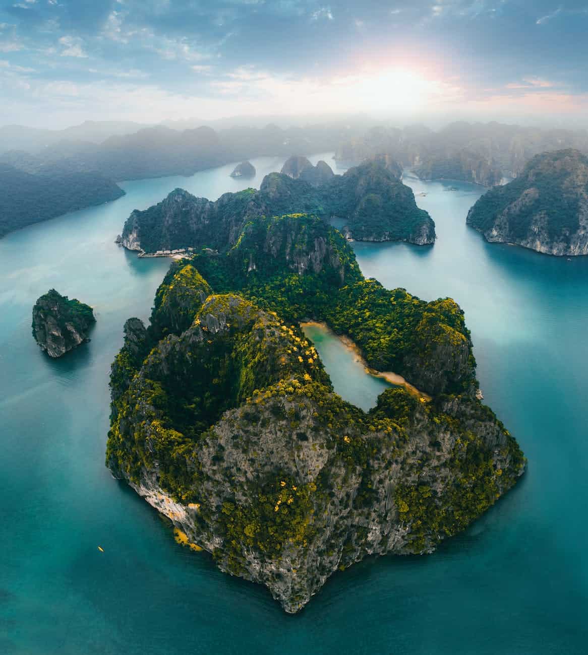 aerial photography of rocky tropical islets at sunrise in theGgalapagos Islands