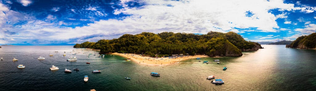 Boats and Jetski at Isla Tortuga ( Tortuga Island ) in a summer day