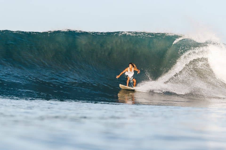 If you plan to surf Nosara, book a lesson with surf instructor Chico Lopez. Seen here catching a wave.
