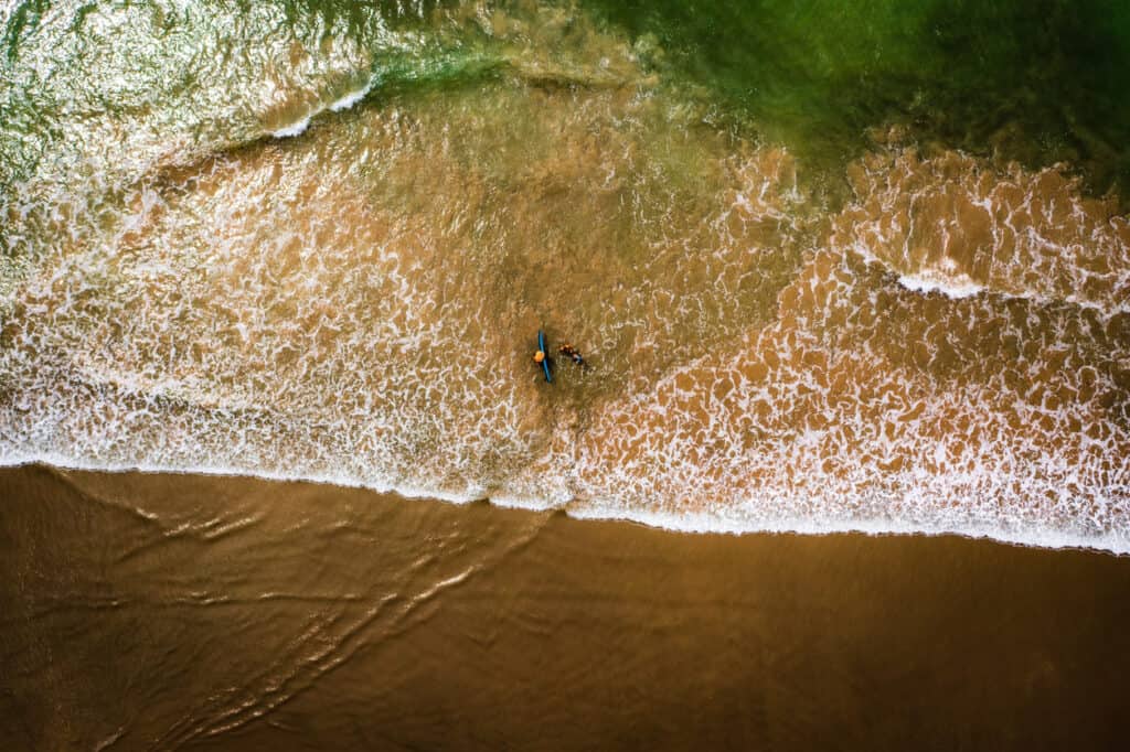Aerial view of beach and Surfers in Nosara, Guanacaste, Costa Rica. Ideal for surfing Nosara