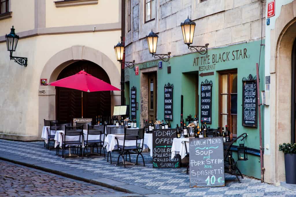 Beautiful corner restaurant at the streets of the old town in Prague city