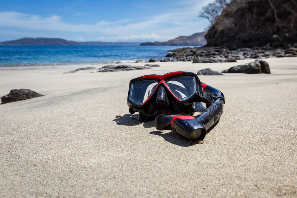 black and red mask with snorkel, ready for snorkeling in Costa Rica