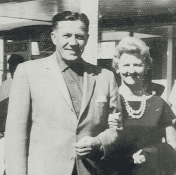 Vintage photo, circa 1960 of stylish married couple, dressed up, maybe on an ordinary Tuesday, black and white