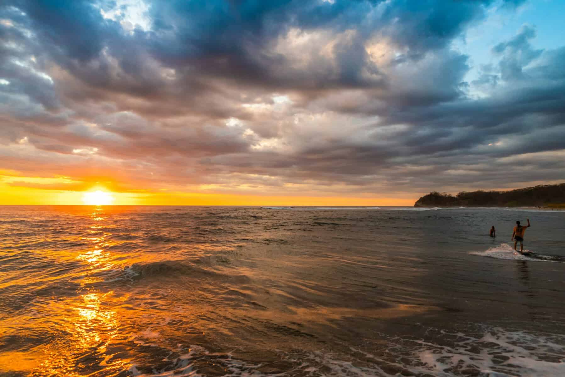 Pacific Ocean view with the sun setting on a beach in Nosara. A great place for yoga in Costa Rica